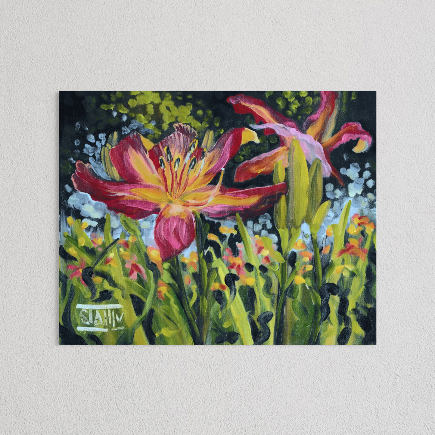 A rectangular canvas oil painting of a vibrant daylily flower in a lush green field, mounted on a textured white wall. The painting features bold brushstrokes in green, pink, yellow, and red, with a visible artist signature 'STAHL' in the bottom-left corner.