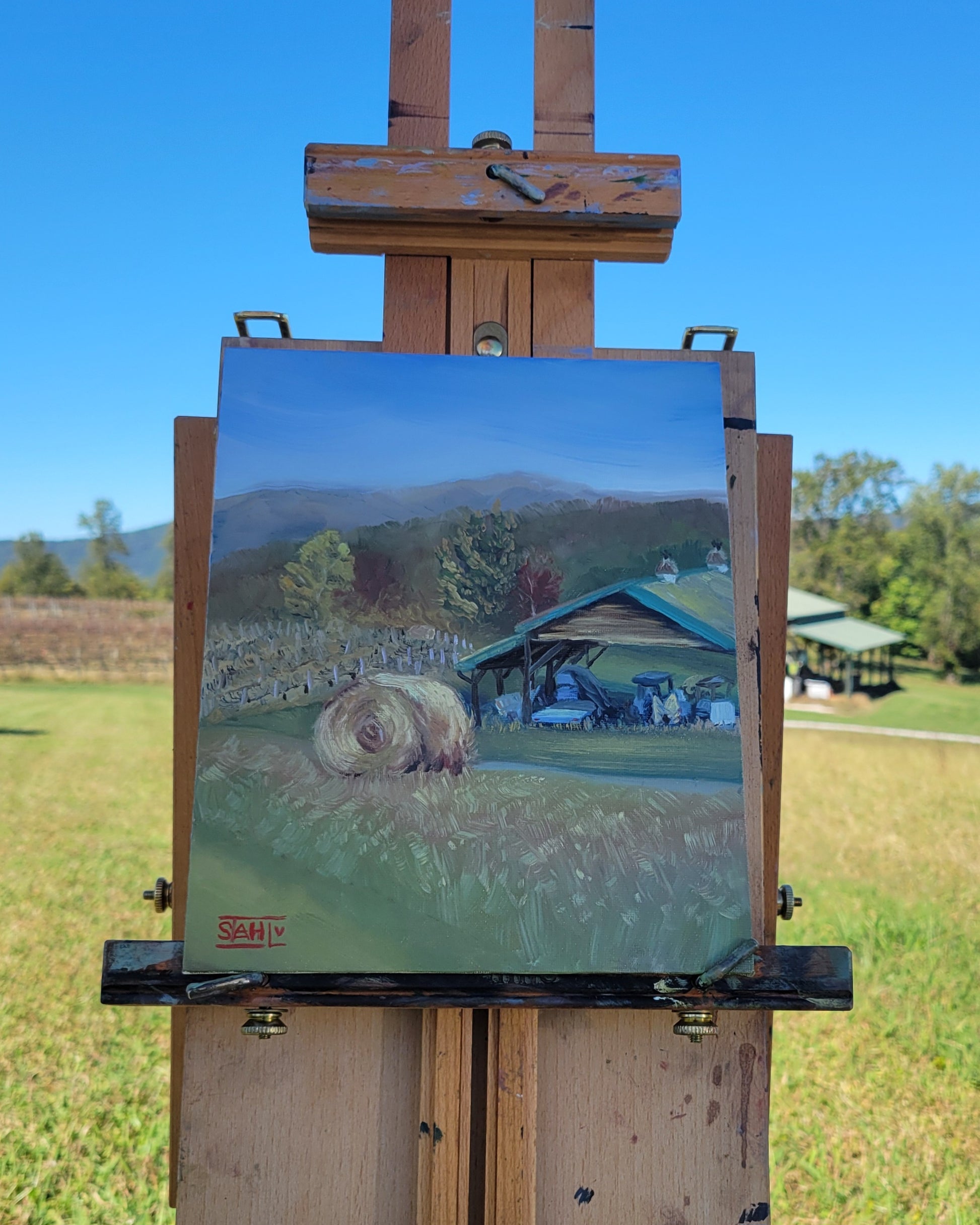 Painting of a landscape with a hay bale in Blaine, Tennessee.