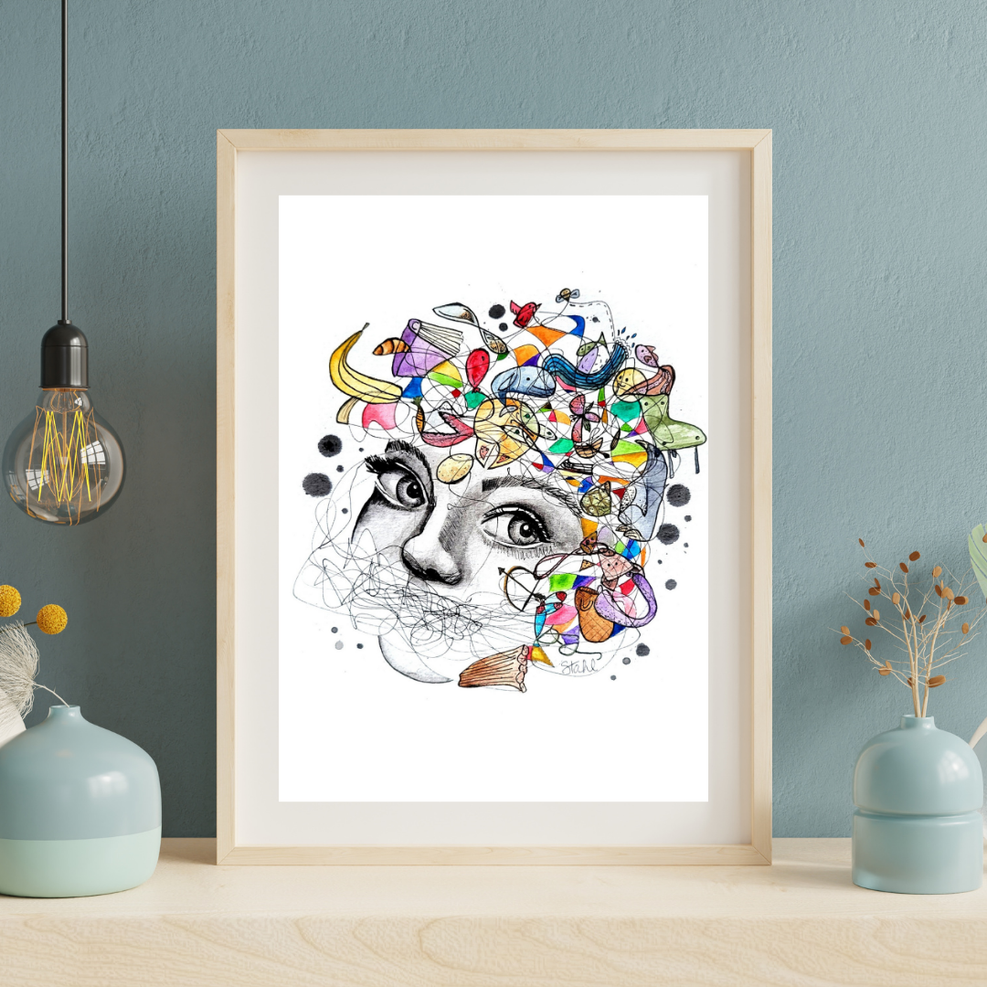 A framed art print featuring a vibrant, abstract design with a central face surrounded by colorful elements, displayed on a wall.